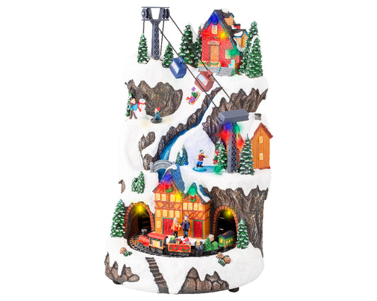 Giostra natalizia 'Villaggio con sciatori' 25,5x29x40H - Lumineo