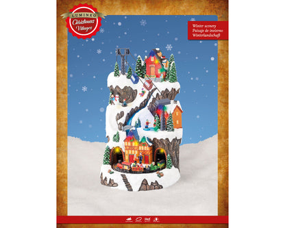 Giostra natalizia 'Villaggio con sciatori' 25,5x29x40H - Lumineo